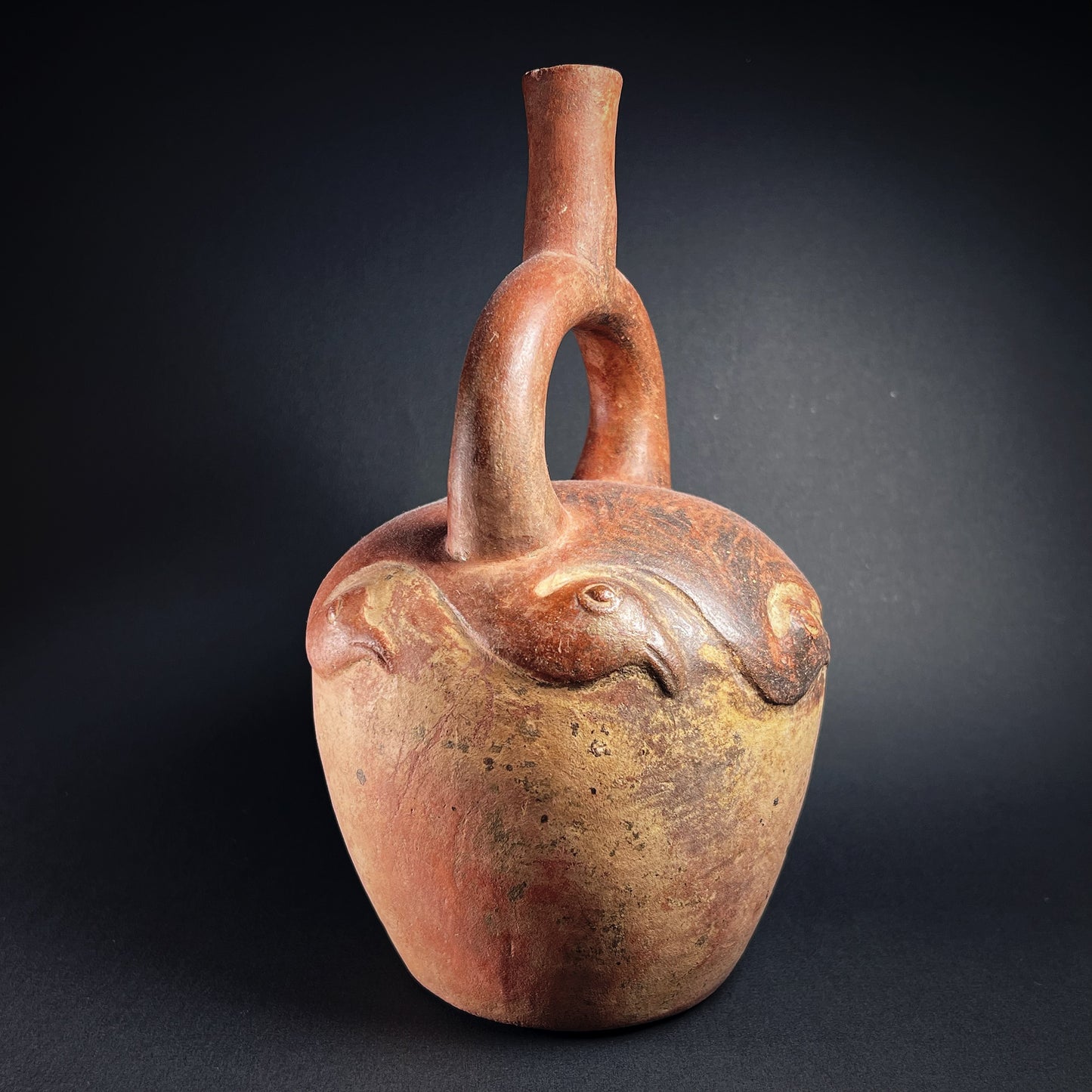 Moche Pottery Stirrup Spout Bottle with Raised Bird Decoration