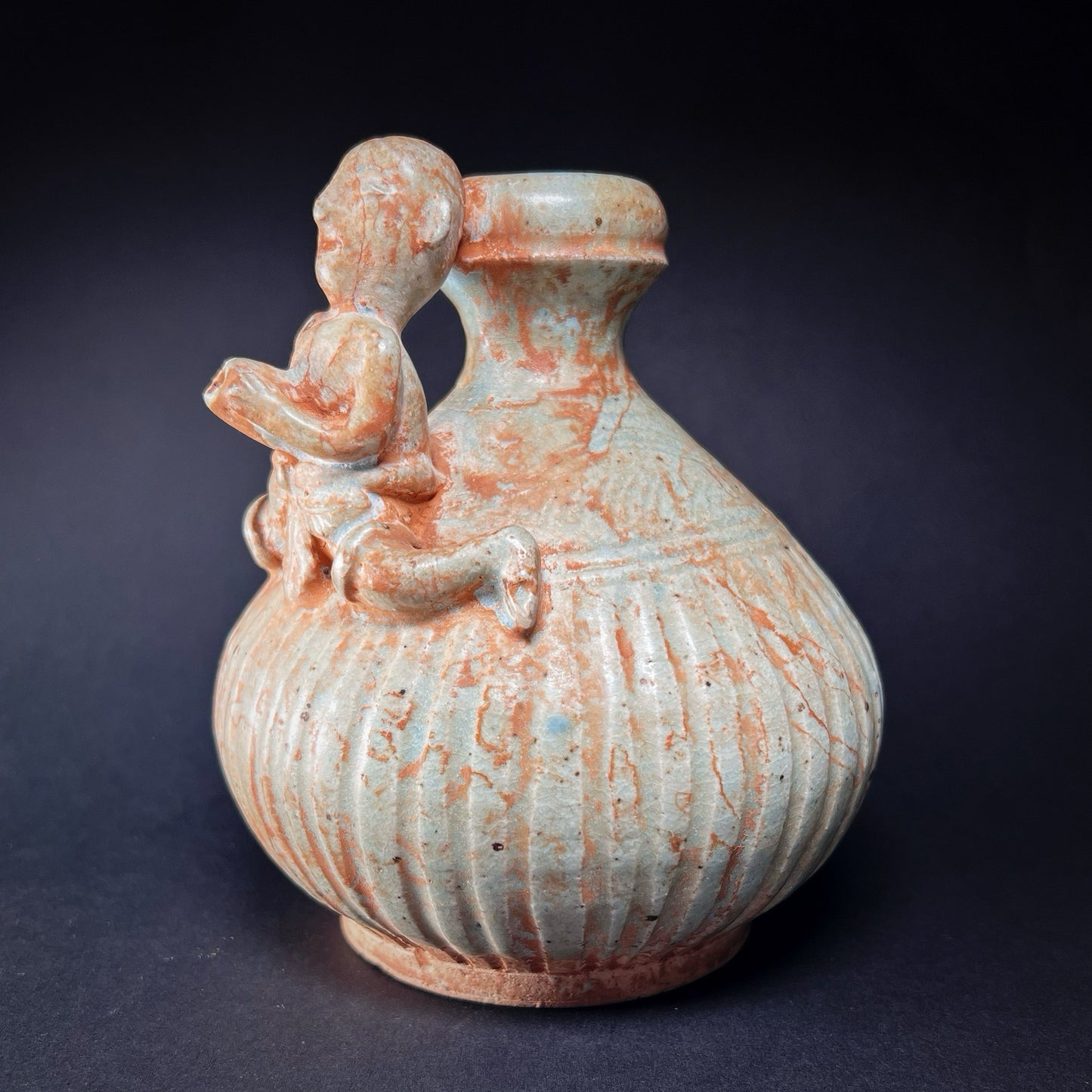 Thai Sawankhalok Celadon Glazed Ritual Ewer with Human Figure (Kendi)