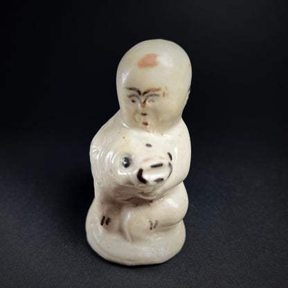Song Dynasty Cizhou Ware Figure of a Seated Boy and Carp