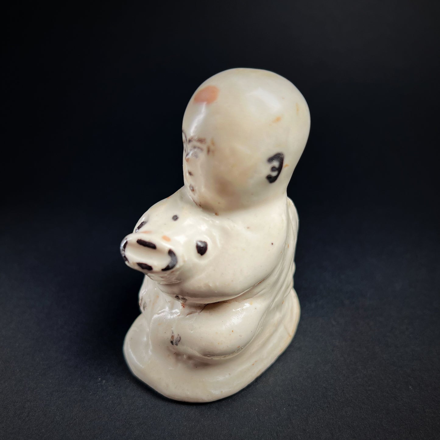 Song Dynasty Cizhou Ware Figure of a Seated Boy and Carp