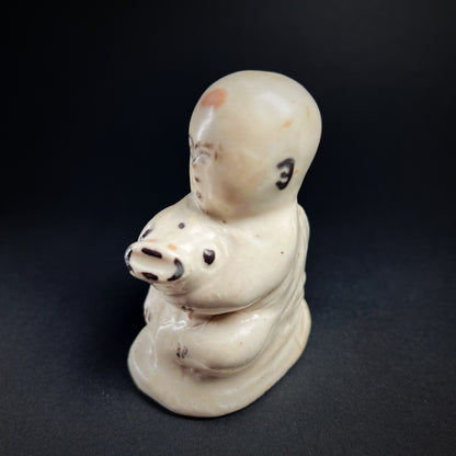 Song Dynasty Cizhou Ware Figure of a Seated Boy and Carp