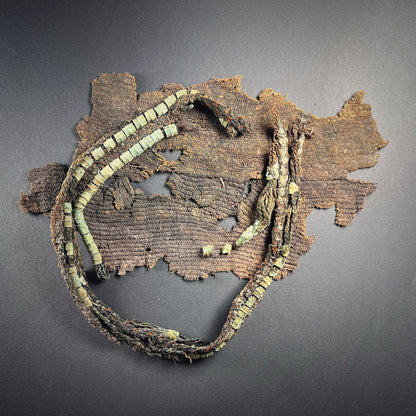 Viking Age Cloth Fragments with Bronze Ring Adornments