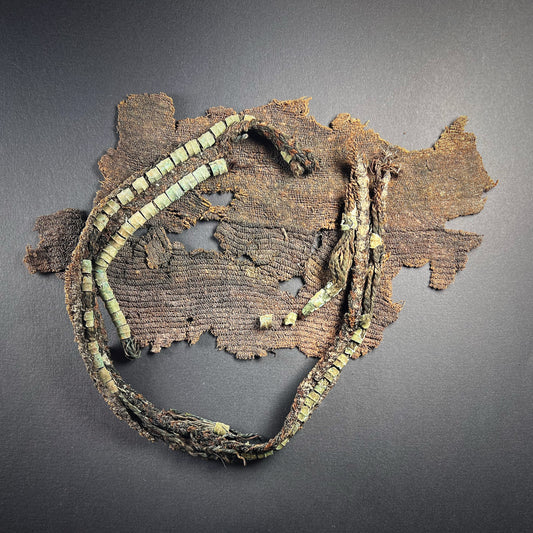 Viking Age Cloth Fragments with Bronze Ring Adornments