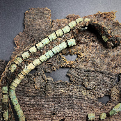 Viking Age Cloth Fragments with Bronze Ring Adornments