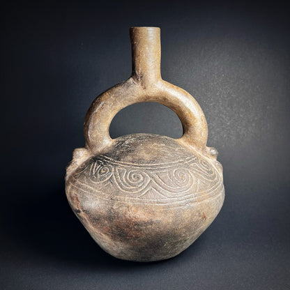 Chimú Blackware Stirrup Spout Vessel with Incised Spiral Motif