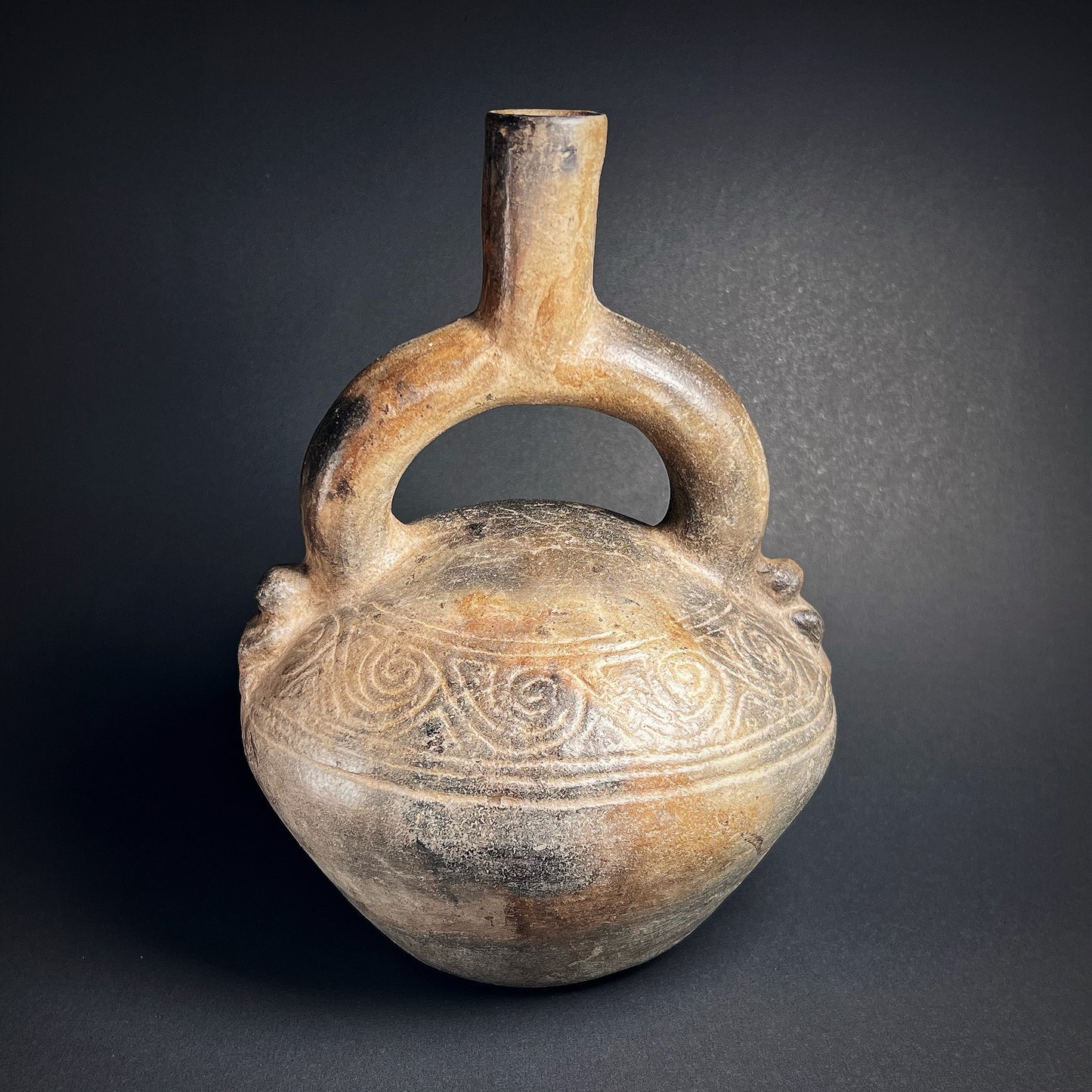 Chimú Blackware Stirrup Spout Vessel with Incised Spiral Motif