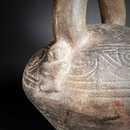 Chimú Blackware Stirrup Spout Vessel with Incised Spiral Motif