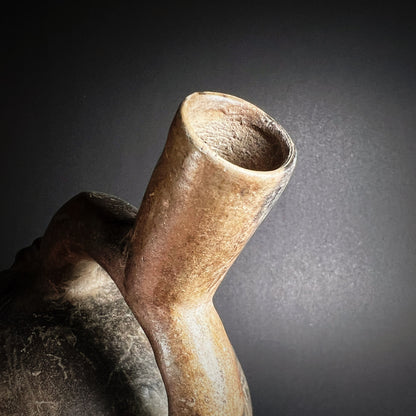 Chimú Blackware Stirrup Spout Vessel with Incised Spiral Motif